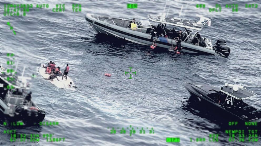PHOTO: U.S. Coast Guard and partnered agencies respond to a capsized vessel and people in the water about 11 miles from Desecheo Island, between Puerto Rico and the island of Hispaniola, May 12, 2022.