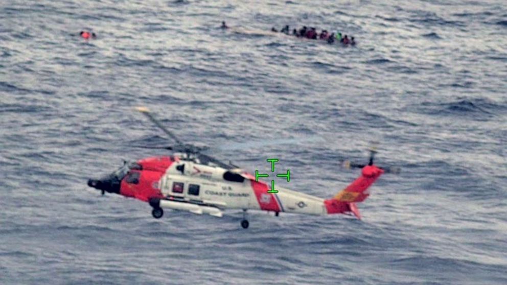 PHOTO: U.S. Coast Guard and partnered agencies respond to a capsized vessel and people in the water about 11 miles from Desecheo Island, between Puerto Rico and the island of Hispaniola, May 12, 2022.