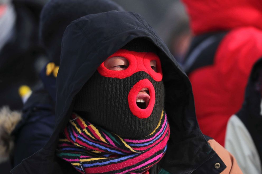 PHOTO: A spectator at the snowboarding events waiting in the cold for the action, Feb. 11, 2018.