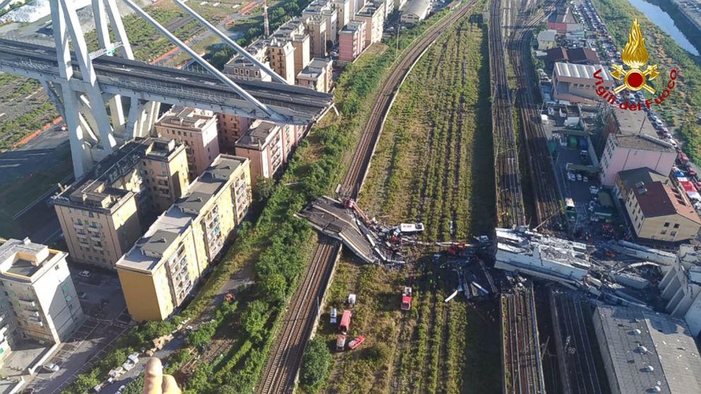 PHOTO: Rescuers at work amid rubble and wreckage after the collapse of a section of the Morandi motorway bridge in Genoa, Italy, Aug. 15, 2018.