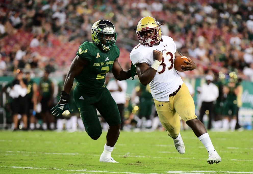 PHOTO: Elon Phoenix player rushes for a first down in the fourth quarter of a football game against the South Florida Bulls in Tampa, Fla