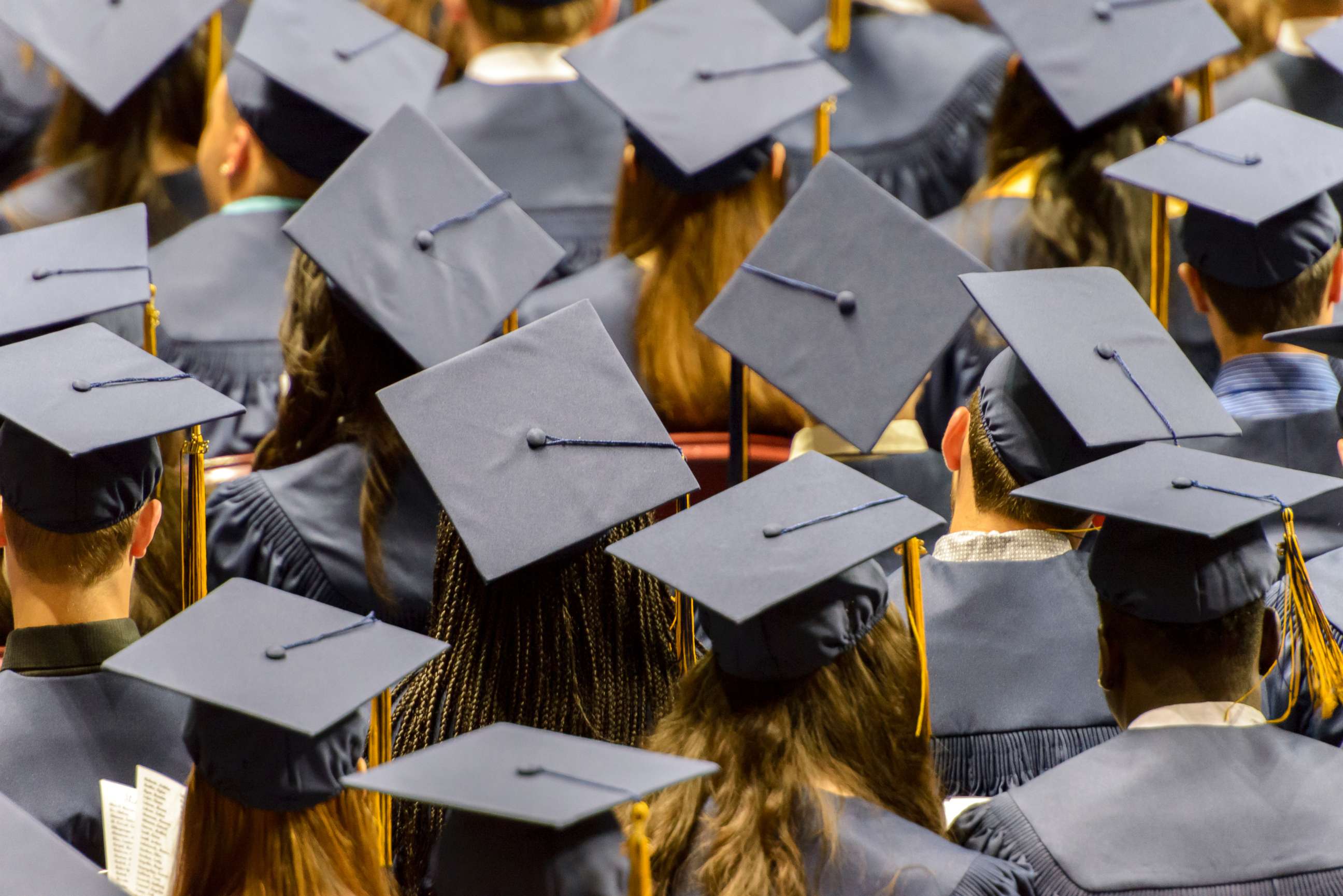 PHOTO: In this undated stock photo shows a group of graduating student wearing caps.