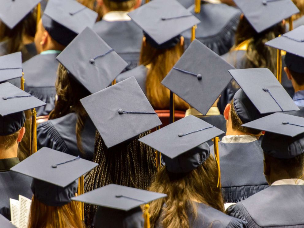 PHOTO: In this undated stock photo shows a group of graduating student wearing caps.