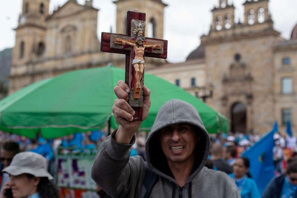 PHOTO: A supporter of the of the anti-abortion rights movement holds a cross during the "United for Life" rally in Bogota, May 4, 2019.