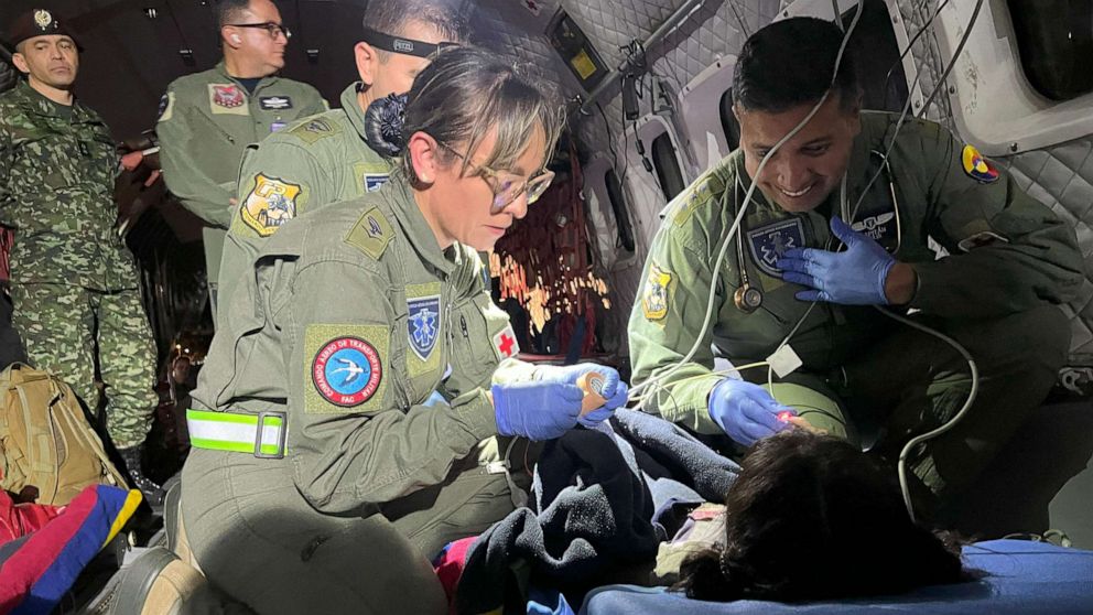 PHOTO: This handout photo released by the Colombian Air Force on June 9, 2023, shows members checking one of the four Indigenous children who were found alive after being lost for 40 days in the Amazon rainforest following a plane crash.