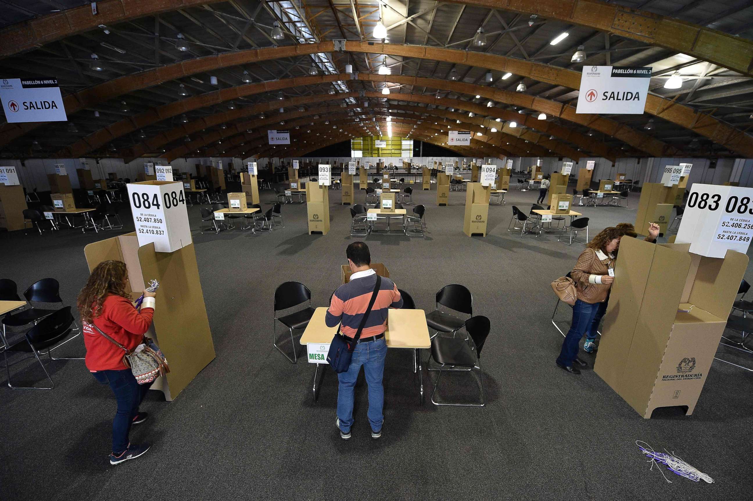 PHOTO: View of preparations at a polling station at the Corferias convention centre in Bogota, June 16, 2018, on the eve of the presidential run-off election.