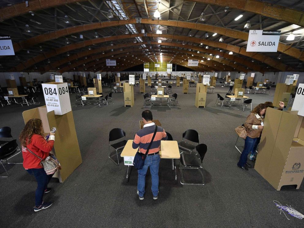 PHOTO: View of preparations at a polling station at the Corferias convention centre in Bogota, June 16, 2018, on the eve of the presidential run-off election.
