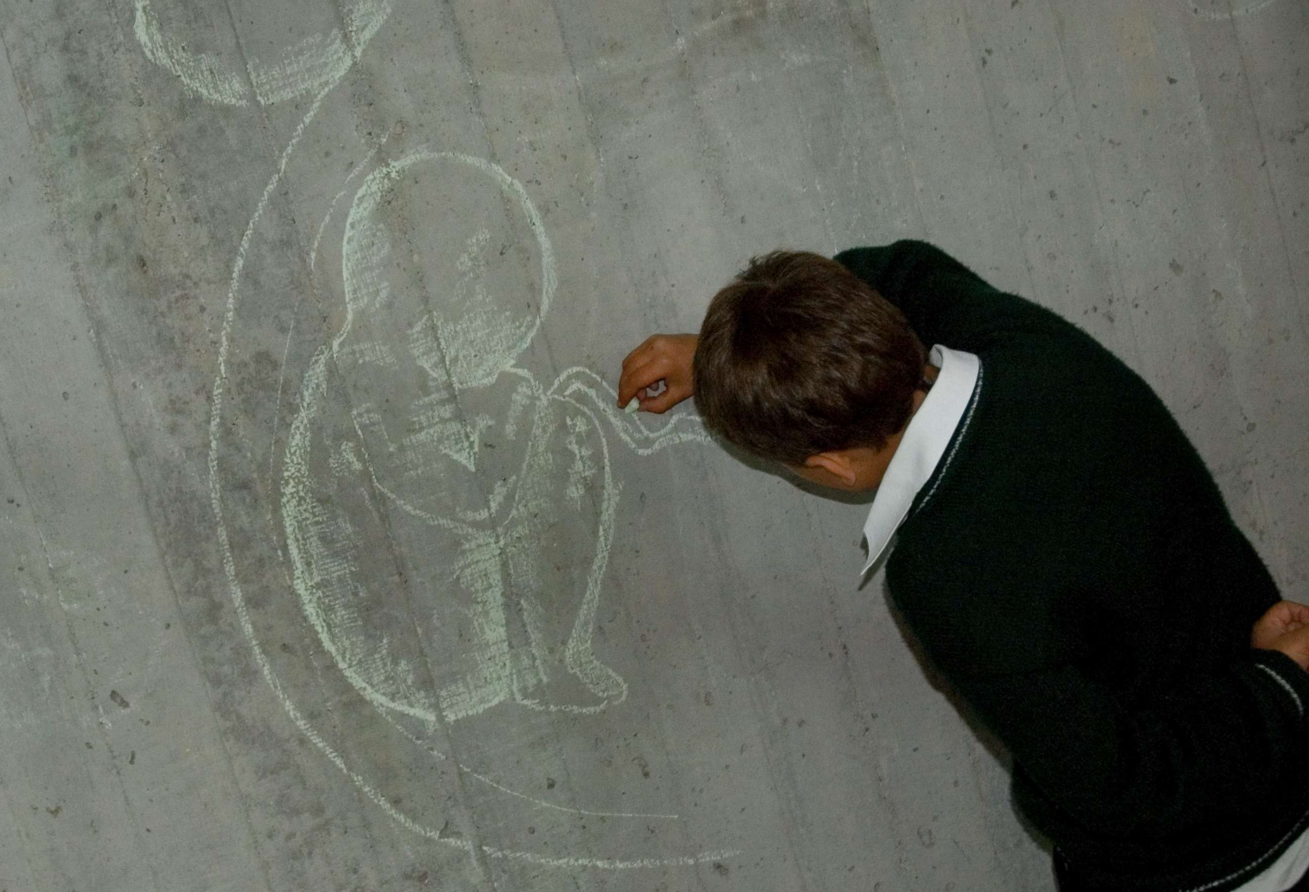 PHOTO: A child draws a fetus on a blackboard during a reproductive health class in Colombia, April 8, 2007.