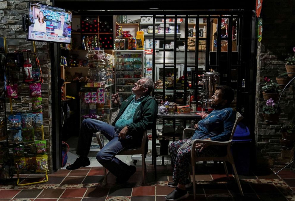 PHOTO: People watch a TV broadcast showing results of the first round of the presidential election, in Medellin, Colombia, May 29, 2022.