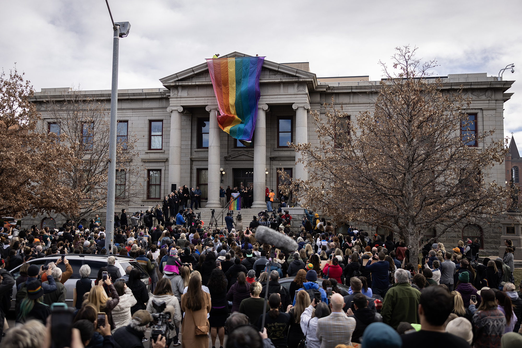 PHOTO: A rainbow pride flag is draped over City Hall in honor of the victims of a shooting at Club Q in Colorado Springs, Colo., Nov. 23, 2022.