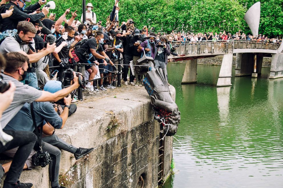 PHOTO: A statue of Edward Colston is pushed into the river Avon in Bristol, England, June 7, 2020.