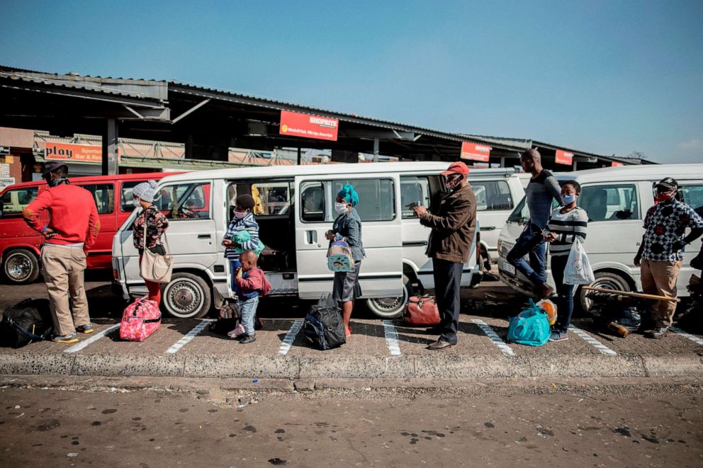 PHOTO: Commuters adhere to physical distancing measures while queueing at the Germiston Taxi Rank near Johannesburg, South Africa, on May 7, 2020.