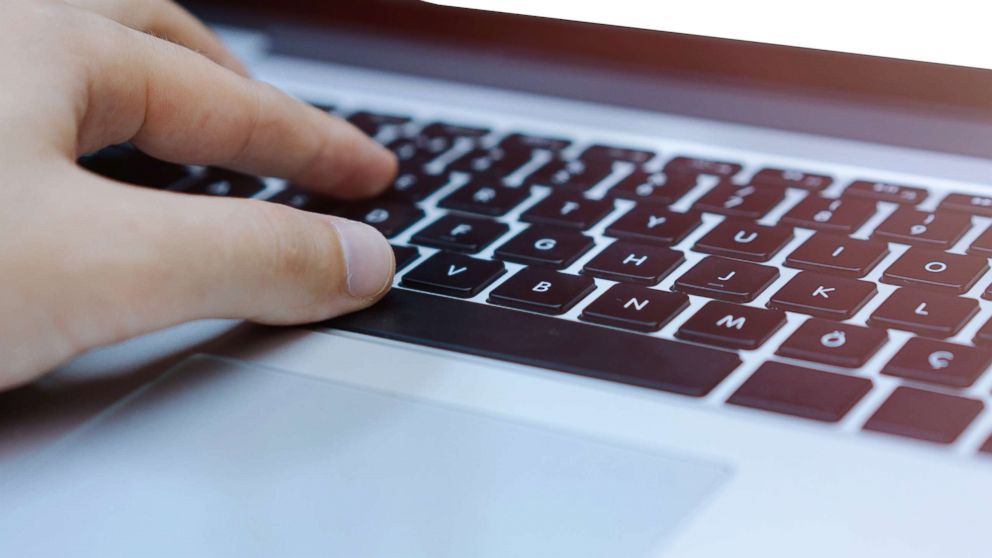 PHOTO: A man types on a laptop in this stock photo.