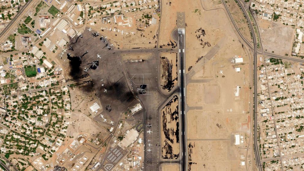 PHOTO: This satellite photo from Planet Labs PBC shows damaged aircraft, including one on fire, at Khartoum International Airport in Khartoum, Sudan, April 17, 2023.