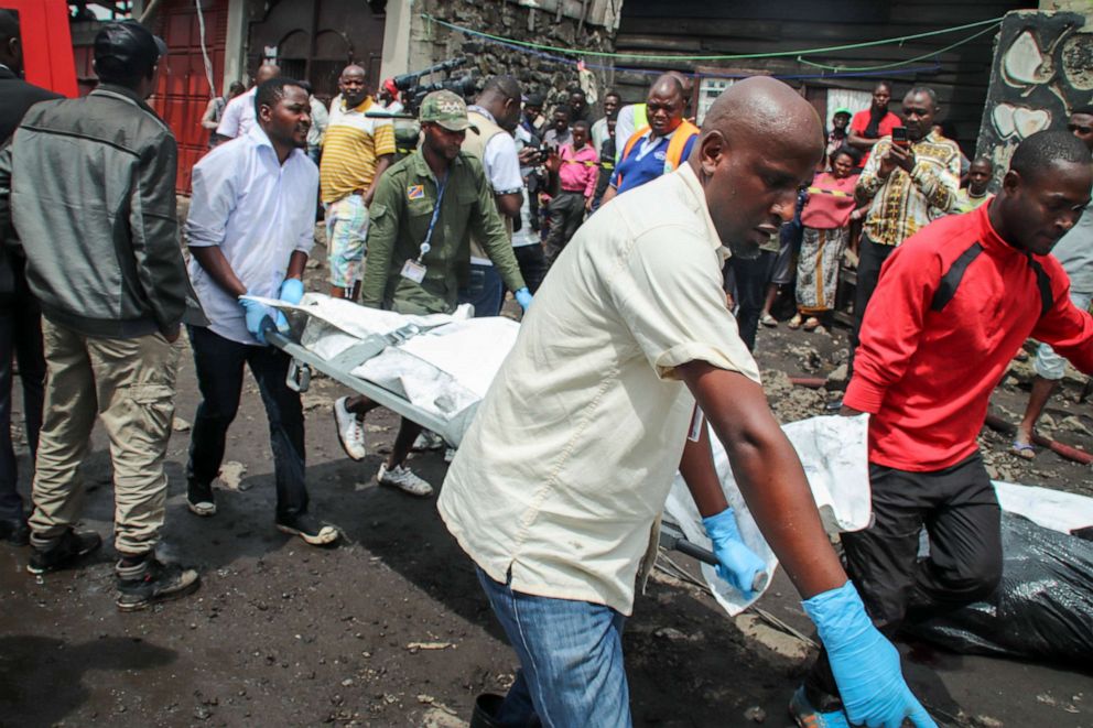 PHOTO: Rescuers remove bodies from the debris of an aircraft operated by private carrier Busy Bee which crashed in Goma, Congo, Nov. 24, 2019. 