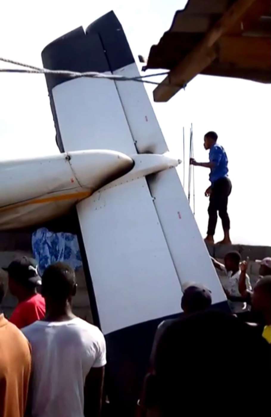 PHOTO: This image grab taken from a video shows people gathering near the wreckage of a plane after it crashed on takeoff into a densely populated area of Goma in the Democratic Republic of Congo, Nov. 24, 2019. 