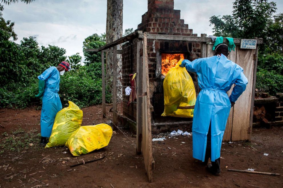 PHOTO: Health workers burn medical waste generated during care of patients with the Ebola virus, Aug. 21, 2018, in Mangina, Democratic Republic of the Congo.