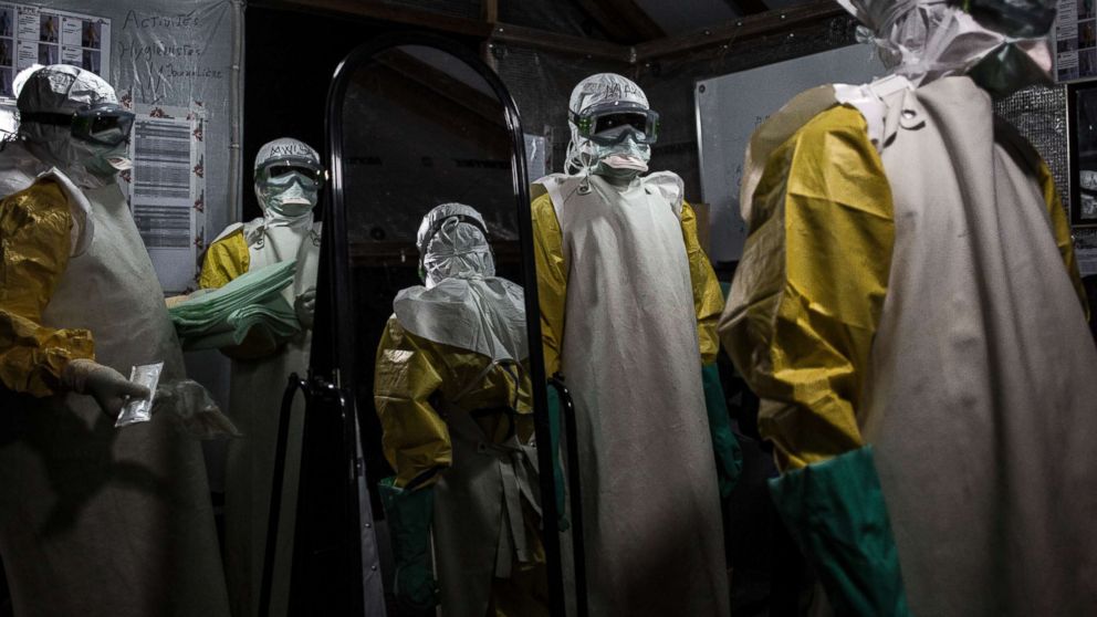 PHOTO: Health workers are seen putting on their personal protective equipment before entering the red zone of a Medecins Sans Frontieres supported Ebola treatment center in Butembo, Congo, Nov. 3, 2018.
