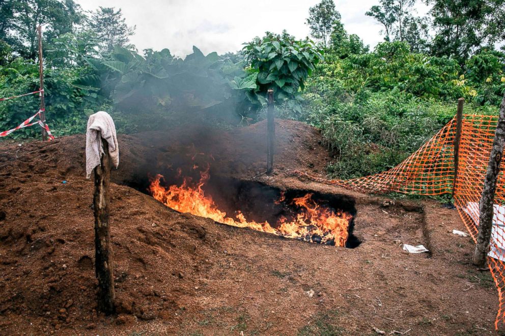 PHOTO: Health workers burn mattresses used by patients with the Ebola virus, Aug. 21, 2018, in Mangina, Democratic Republic of the Congo.