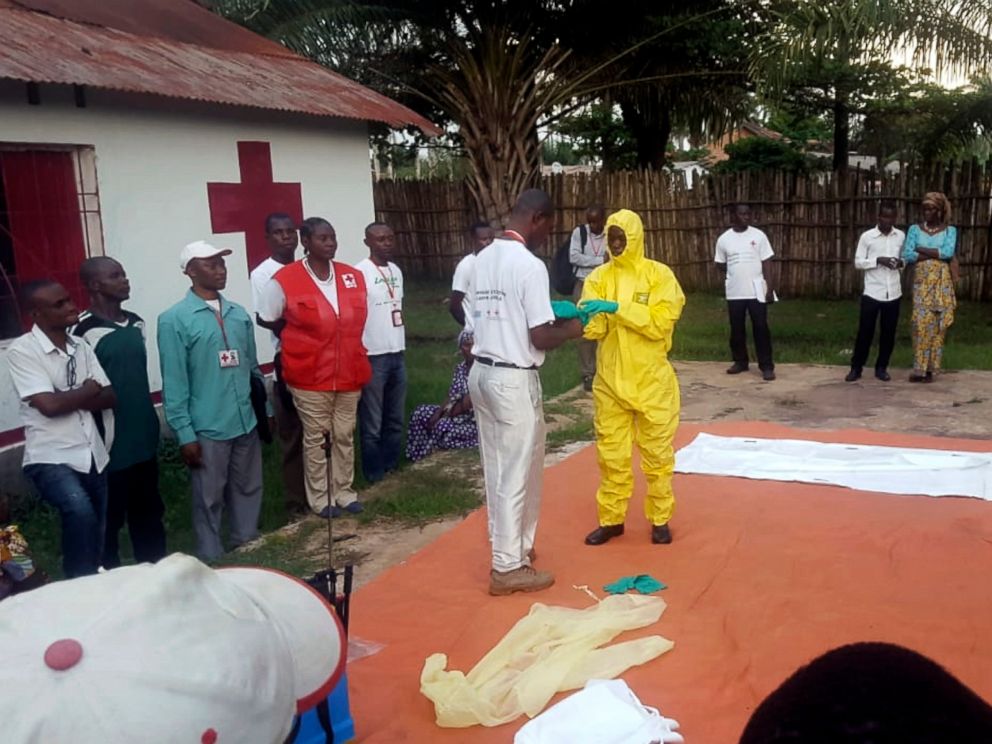 PHOTO: Members of a Red Cross team don protective clothing before heading out to look for suspected victims of Ebola, in Mbandaka, Congo, May 14, 2018.