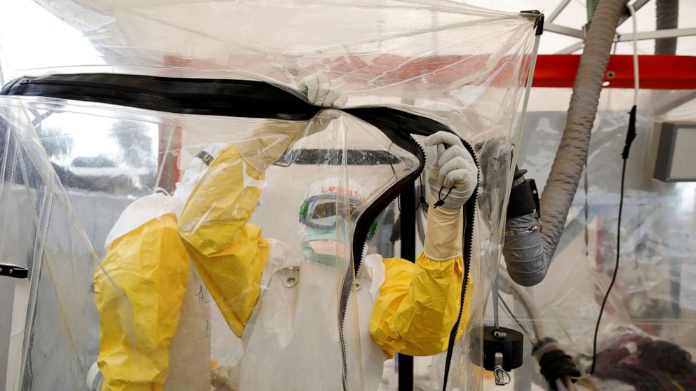 PHOTO: A health worker wearing Ebola protection gear enters the Biosecure Emergency Care Unit (CUBE) at the ALIMA (The Alliance for International Medical Action) Ebola treatment center in Beni, in the Democratic Republic of the Congo, April 1, 2019.