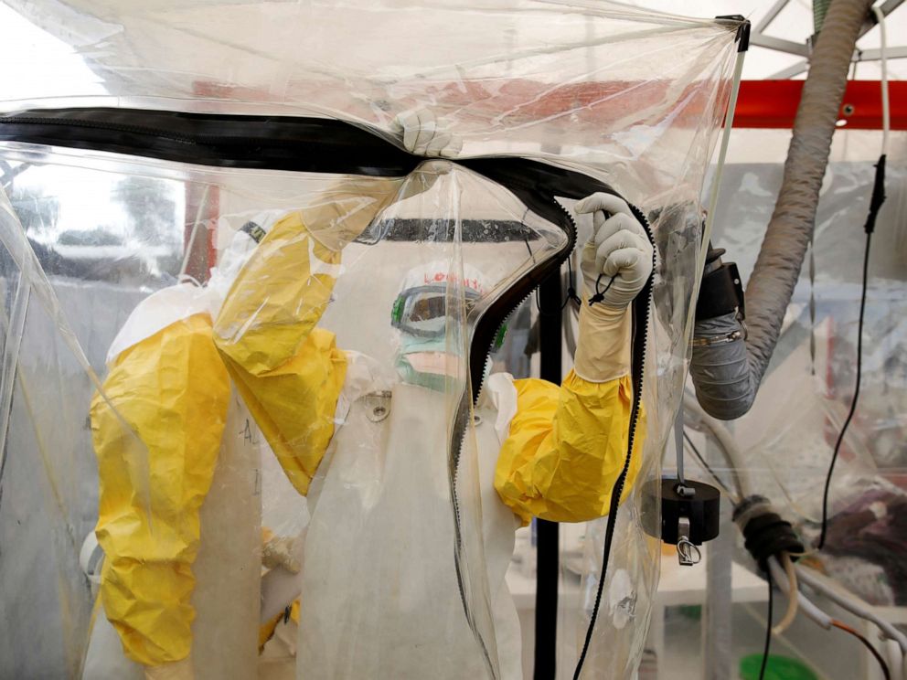 PHOTO: A health worker wearing Ebola protection gear enters the Biosecure Emergency Care Unit (CUBE) at the ALIMA (The Alliance for International Medical Action) Ebola treatment center in Beni, in the Democratic Republic of the Congo, April 1, 2019.