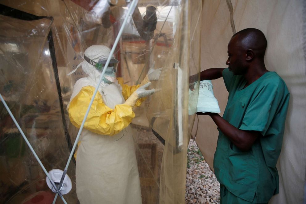 PHOTO: In this file photo, a health worker wearing Ebola protection gear enters the ALIMA (The Alliance for International Medical Action) Ebola treatment centre in Beni, in the Democratic Republic of Congo, March 30, 2019. 