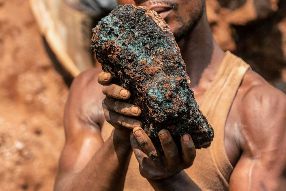 PHOTO: Dela wa Monga, an artisanal miner, holds a cobalt stone at the Shabara artisanal mine near Kolwezi, Democratic Republic of Congo, Oct. 12, 2022.