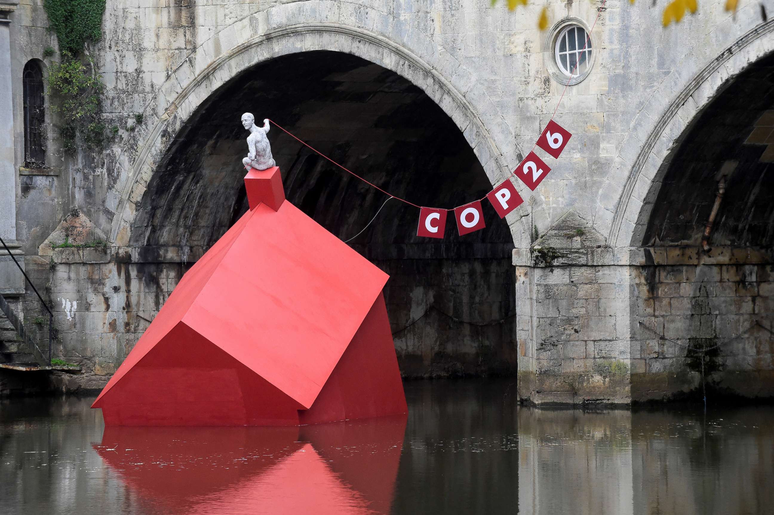 PHOTO: An installation of a 'Sinking House' partly submerged to highlight climate change ahead of COP26, in Bath, Britain, Oct. 26, 2021.