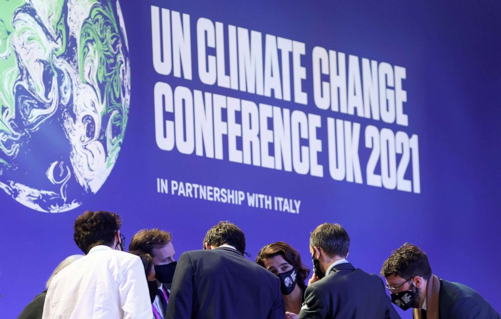 PHOTO: Delegates talk during the UN Climate Change Conference (COP26) in Glasgow, Scotland, Nov. 13, 2021.