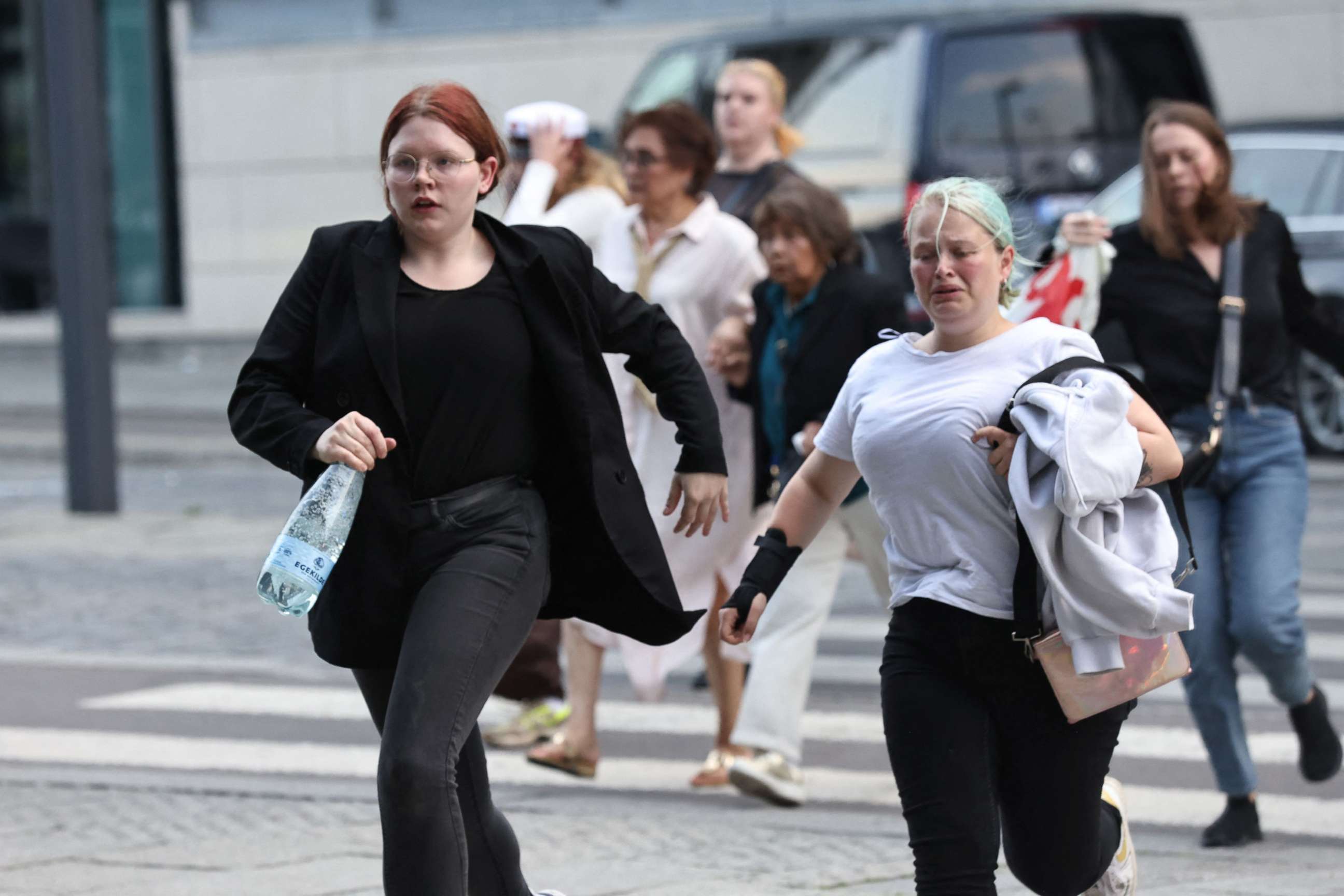 PHOTO: People are seen running during the evacuation of the Fields shopping center after reports of a shooting in Copenhagen, Denmark, on July 3, 2022.