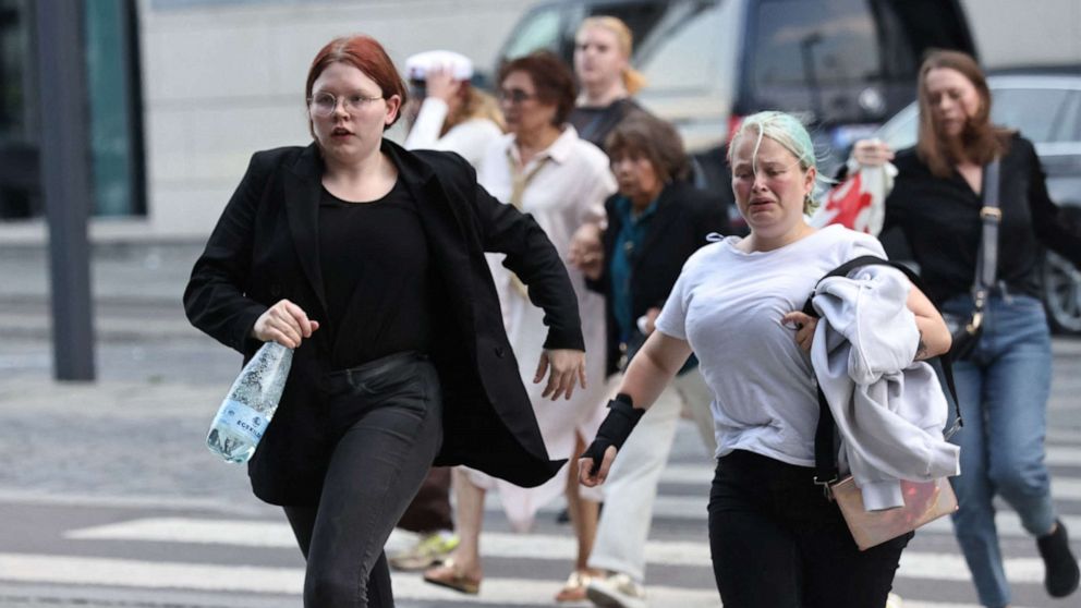 PHOTO: People are seen running during the evacuation of the Fields shopping center after reports of a shooting in Copenhagen, Denmark, on July 3, 2022.