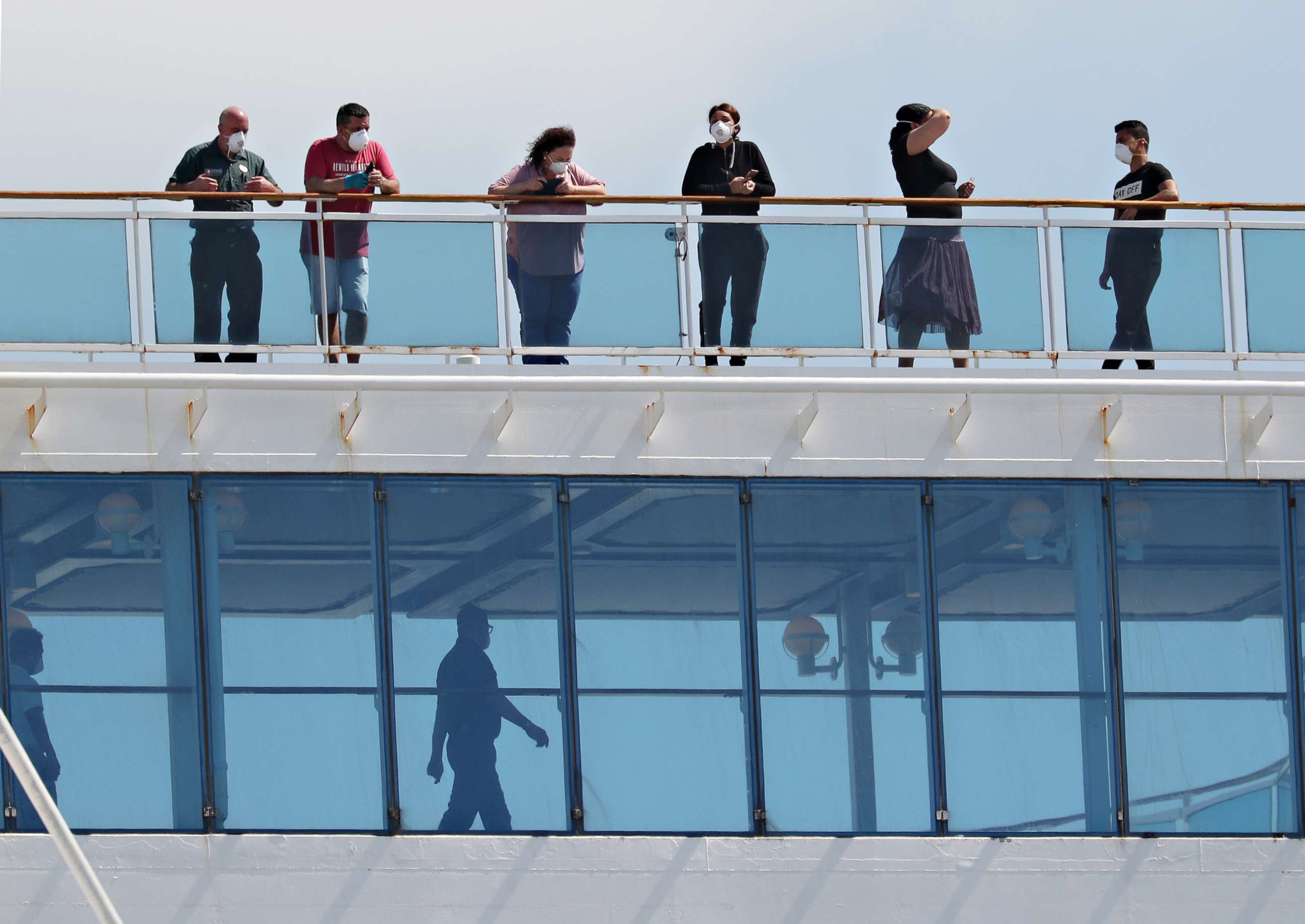 PHOTO: People are seen on board the Coral Princess cruise ship after it docked at Port Miami,  on April 04, 2020, in Miami.