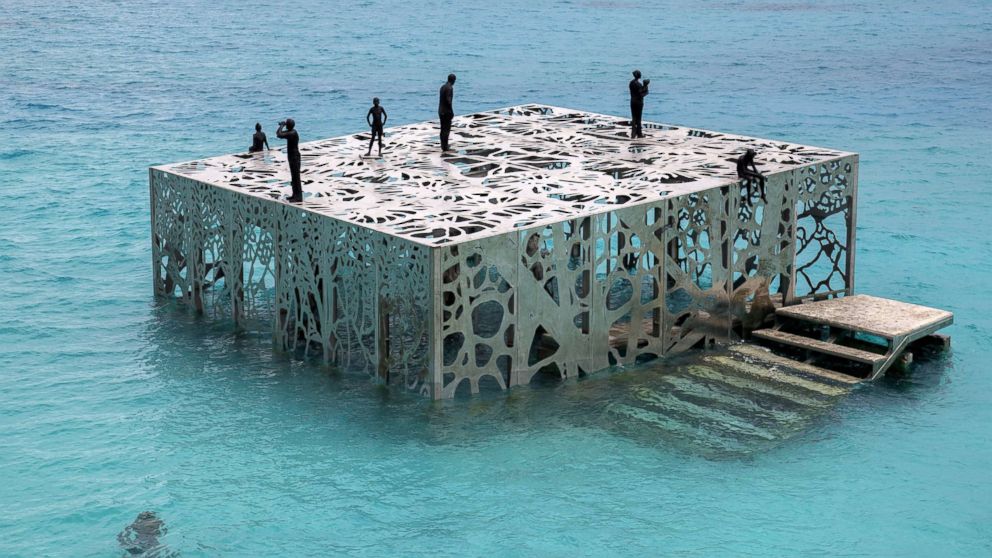 Artist and environmental sculptor Jason deCaires Taylor has created a semi-submerged tidal gallery exhibiting a number of artworks designed to evolve over time as they are colonized by algae and weathered by the environment, called Coralarium, Aug 14, 2018, in the Maldives.