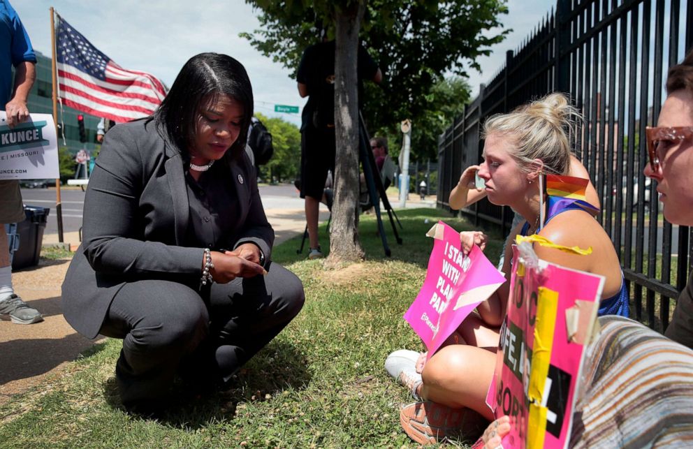 PHOTO: Abortion-rights advocates U.S. Rep. Cori Bush, left, Kendyl Underwood and Brittany Nickens, react outside Planned Parenthood of Missouri after the U.S. Supreme Court overturned abortion protections on June 24, 2022, in St. Louis.