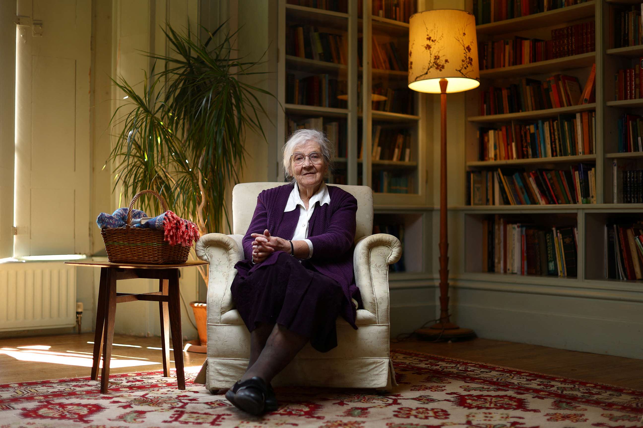 PHOTO: Pamela Tawse, 88, poses for a photograph in the library room of the Hawkwood Centre for Future Thinking in Stroud, Britain, April 20, 2023.