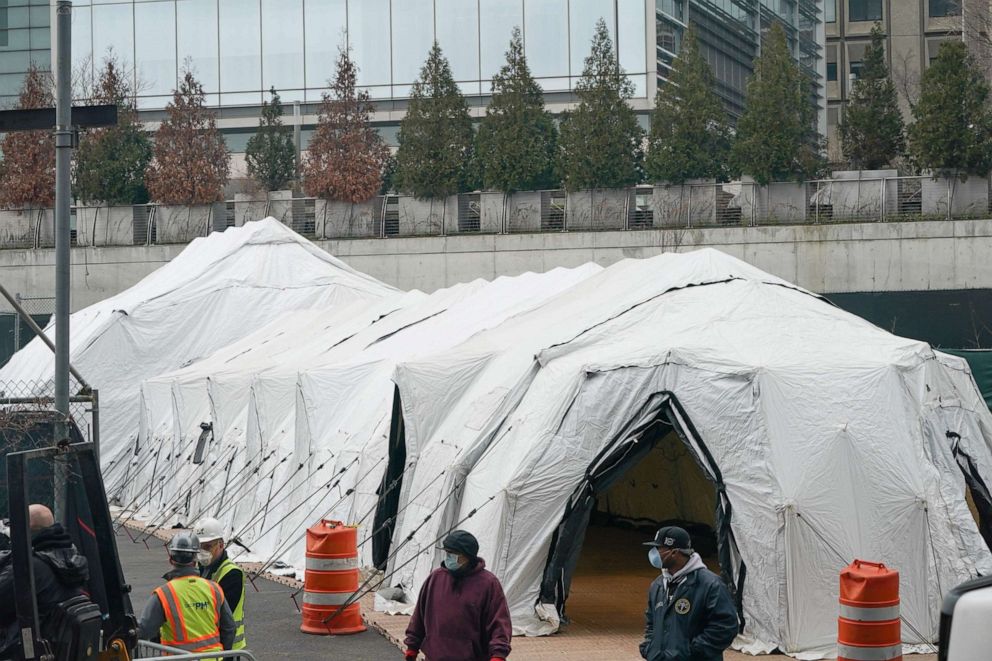 PHOTO: Workers build a makeshift morgue outside of Bellevue Hospital to handle an expected surge in Coronavirus victims on March 25, 2020 in New York.