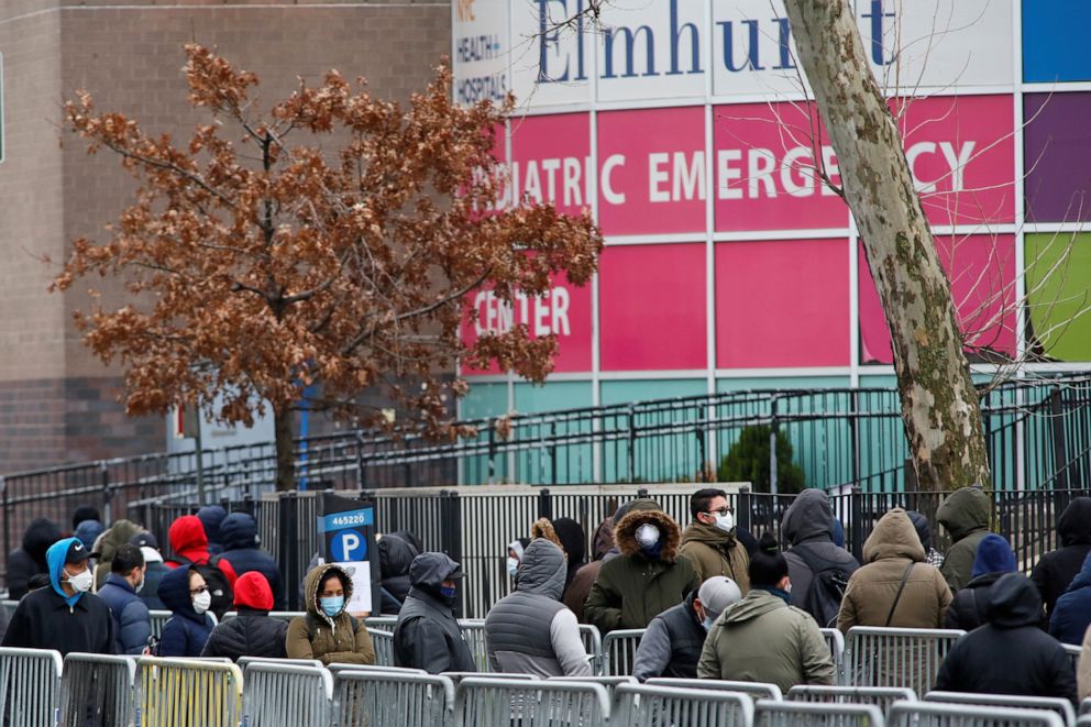 PHOTO: People wait in line to be tested for coronavirus disease outside Elmhurst Hospital Center in the Queens borough of New York, March 25, 2020.