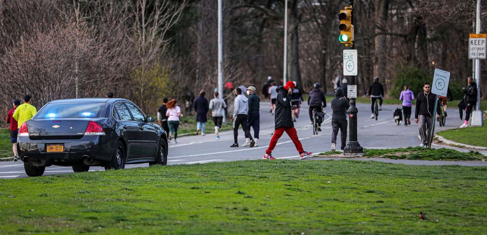 PHOTO: People walk and jog in Brooklyn's Prospect Park Tuesday, March 24, 2020, in New York.
