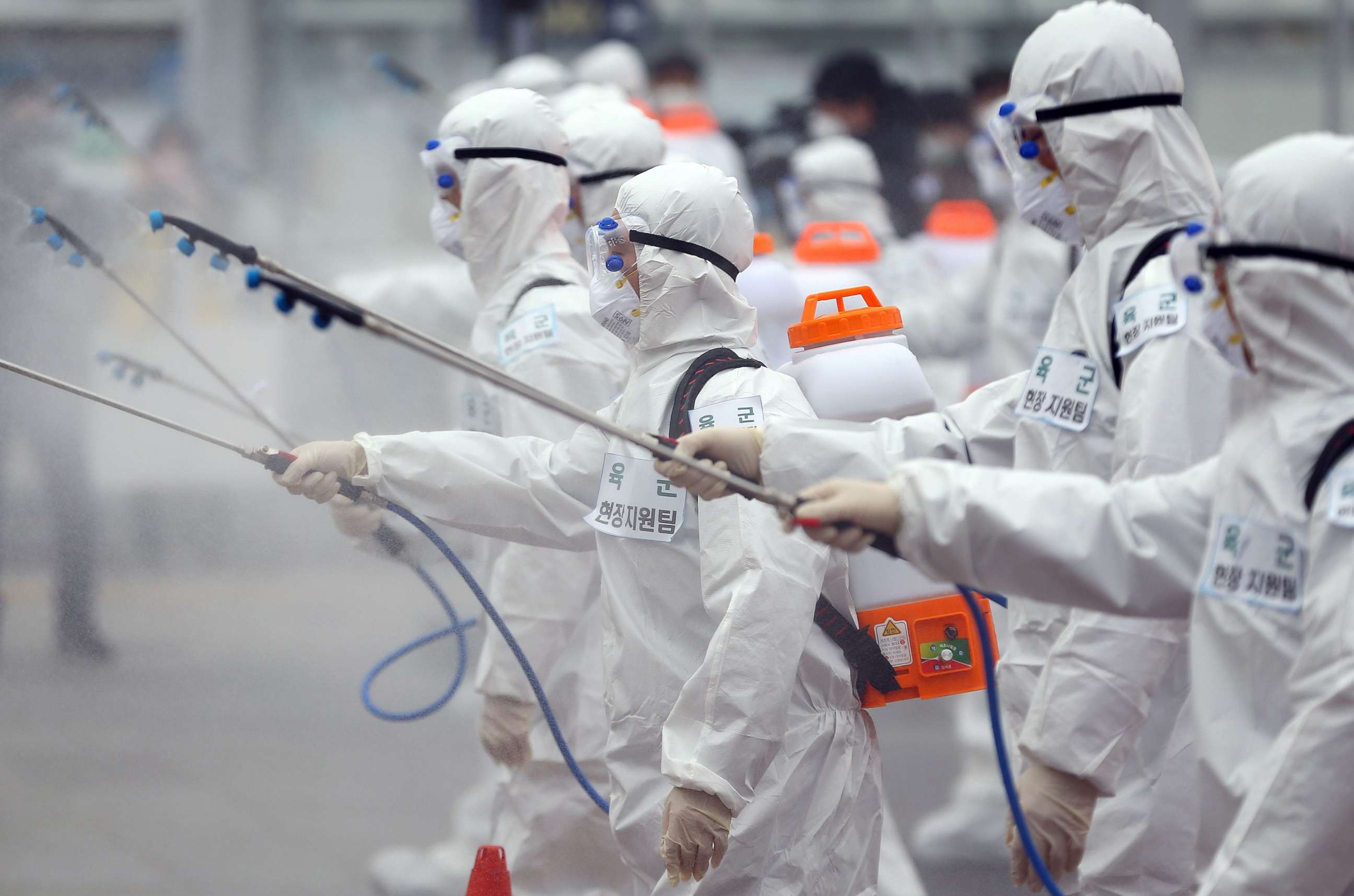 PHOTO: Soldiers wearing protective gear spray disinfectant as part of preventive measures against the spread of the coronavirus, at Dongdaegu railway station in Daegu, South Korea, Feb. 29, 2020. 