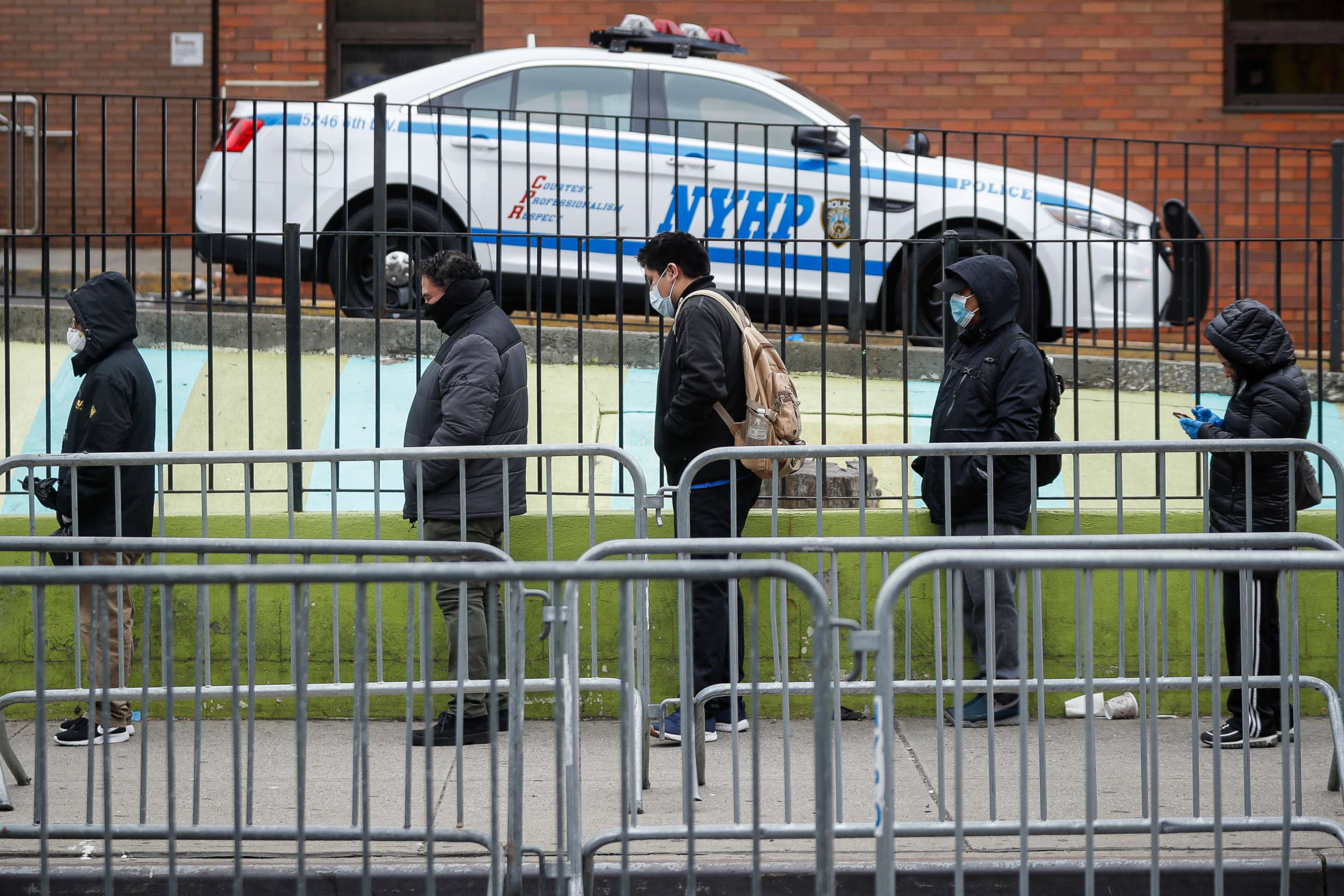 PHOTO: Patients maintain social distancing while they wait in line for a COVID-19 test at Elmhurst Hospital Center, March 25, 2020, in New York.