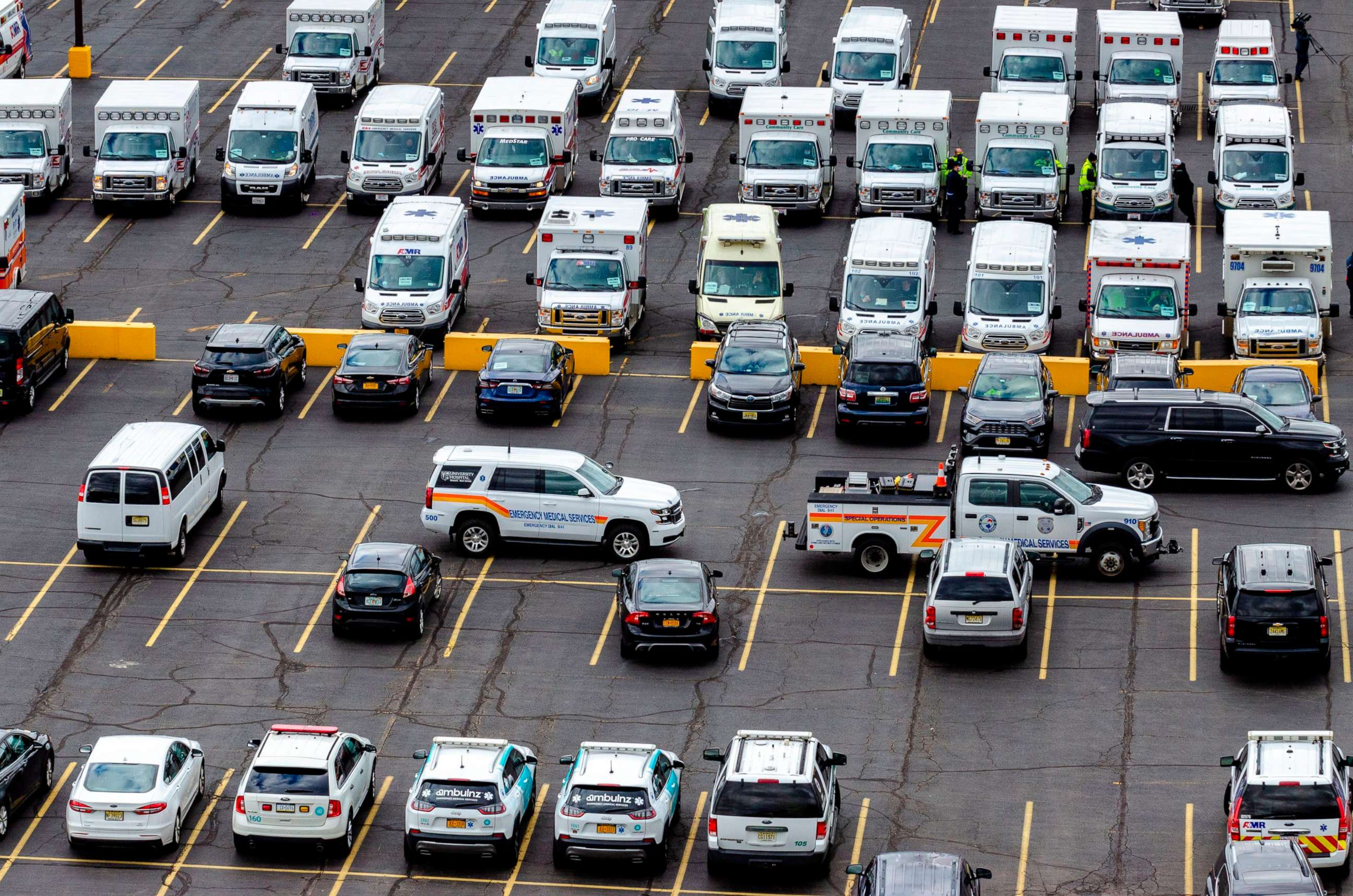 PHOTO: Dozens of ambulances arrive in East Rutherford, New Jersey at MetLife Stadium after New Jersey activated a FEMA ambulance contract requesting 50 Basic Life Support and 25 Advanced Life Support ambulances, April 10, 2020. 