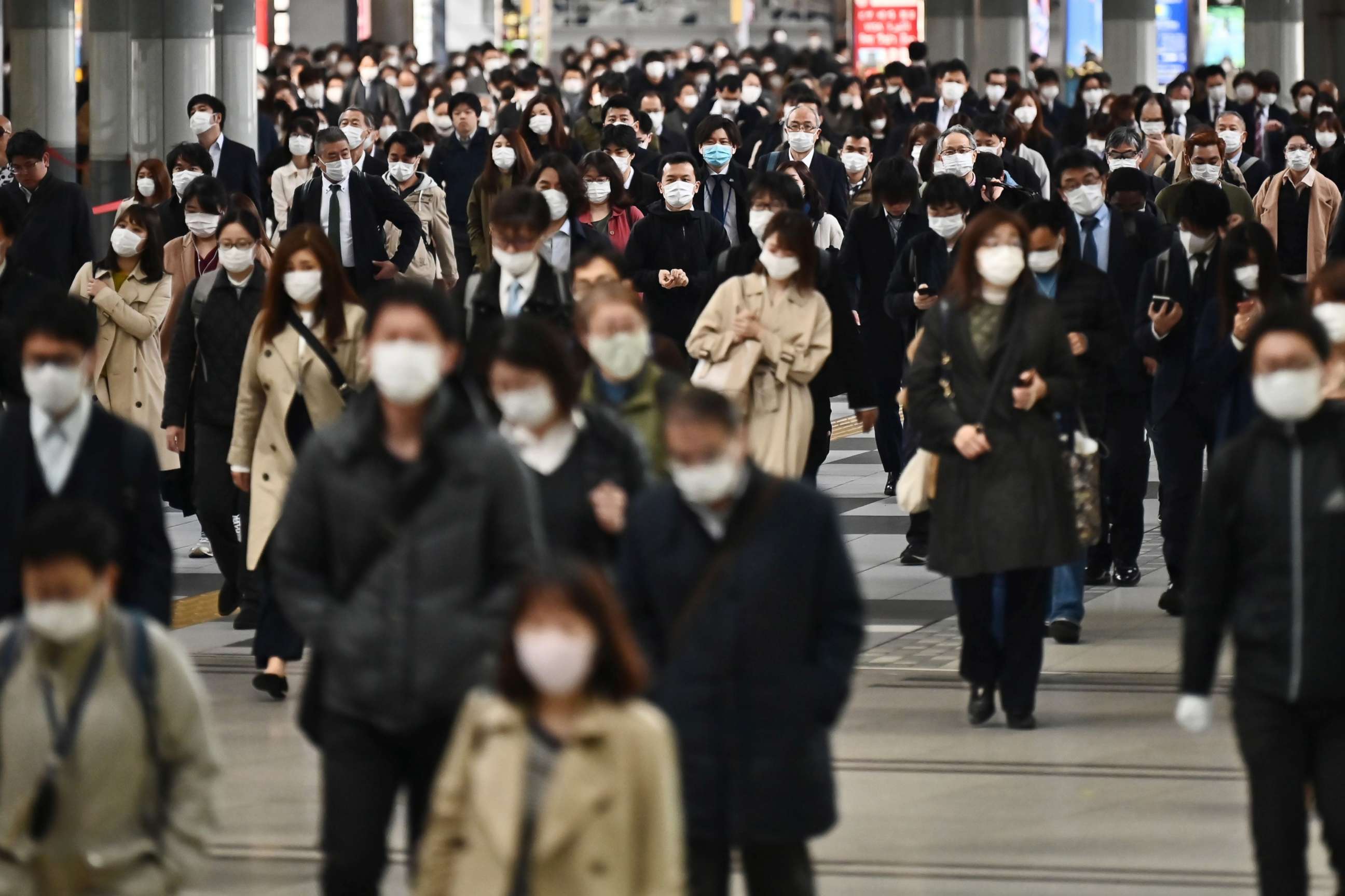 PHOTO: People commute to work despite a state of emergency in Japan at Shinagawa station in Tokyo, April 16, 2020. 