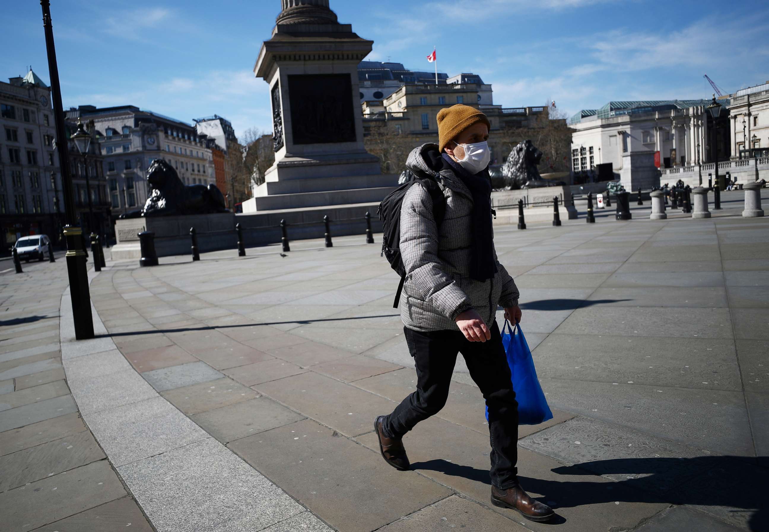 PHOTO: A man wears a mask in Trafalgar Square as the spread of the coronavirus continues, in London, March 23, 2020. 