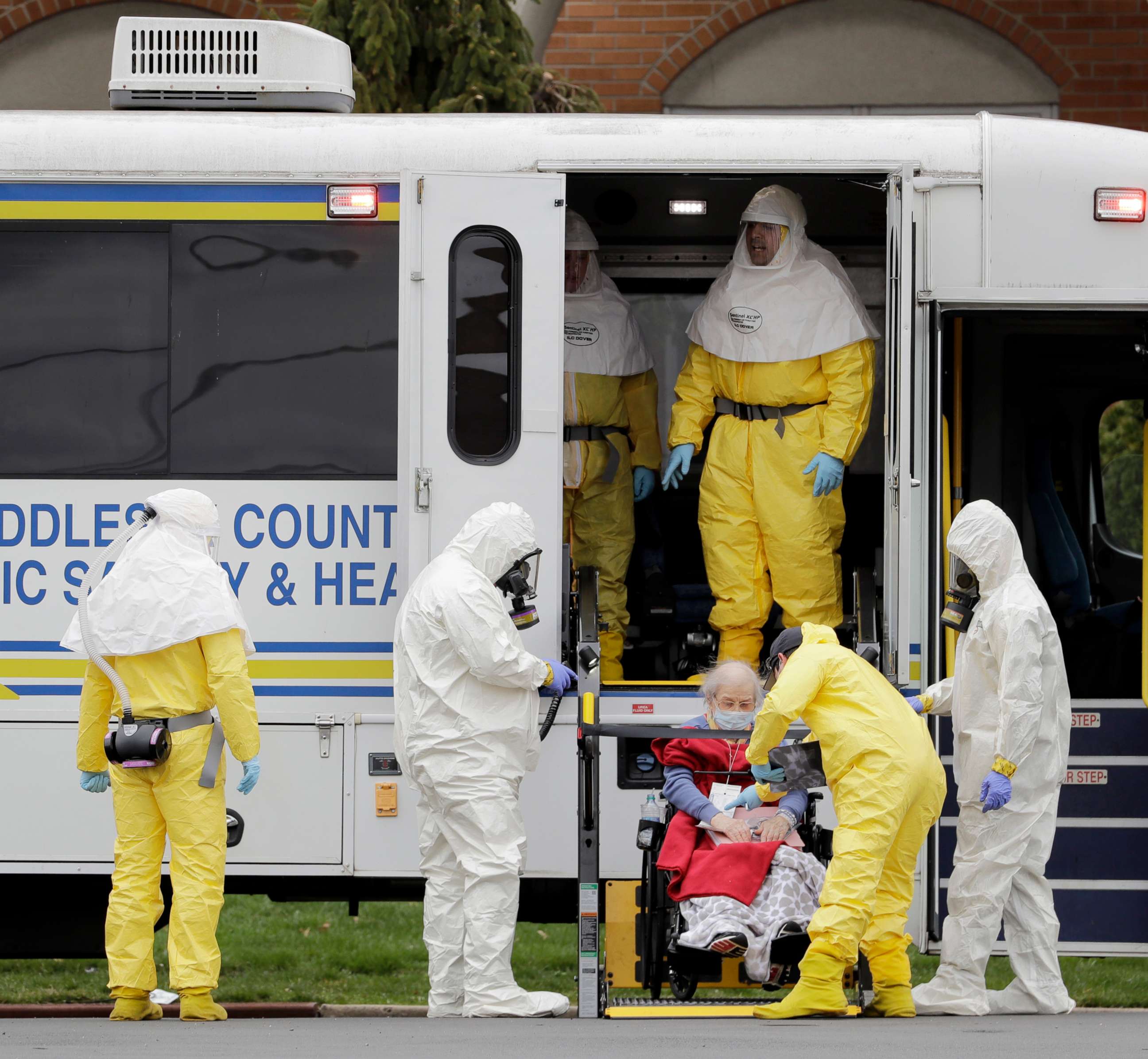 PHOTO: Residents from St. Joseph's Senior Home are helped on to buses in Woodbridge, N.J., Wednesday, March 25, 2020.