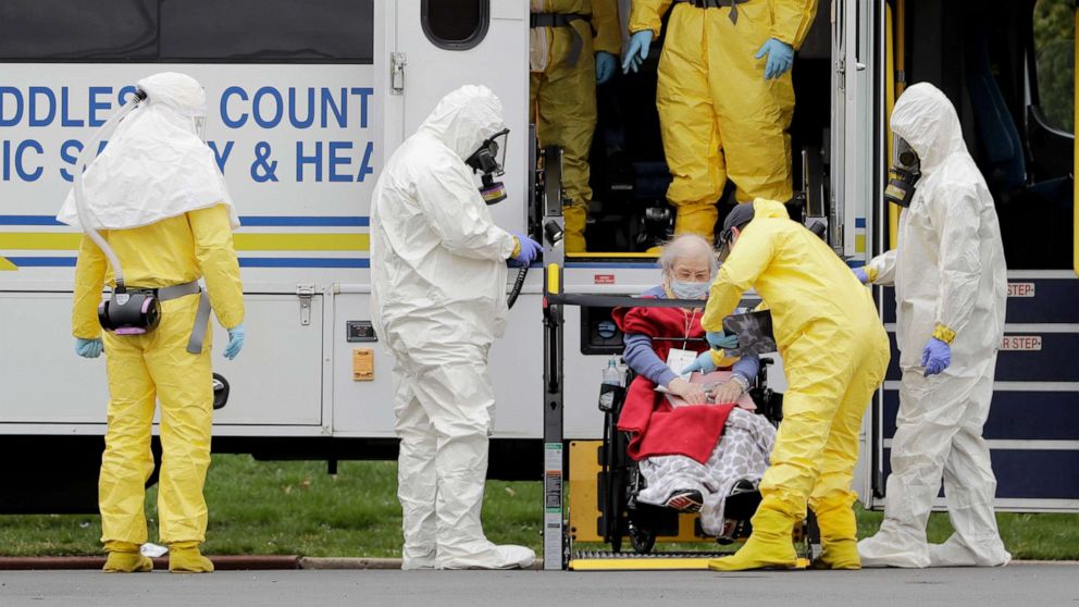 PHOTO: Residents from St. Joseph's Senior Home are helped on to buses in Woodbridge, N.J., Wednesday, March 25, 2020.