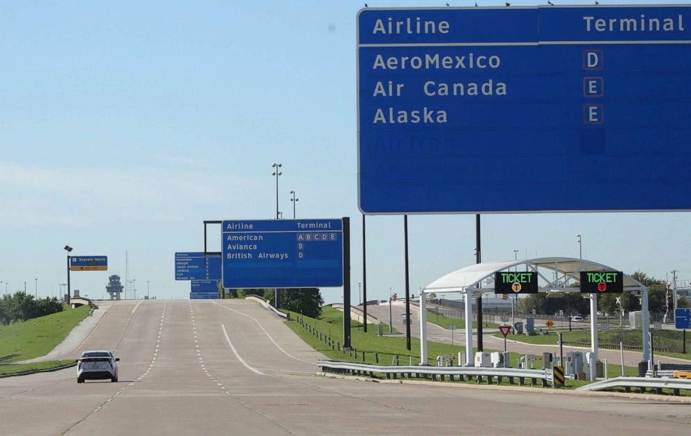 PHOTO: A lone vehicle drives inside the Dallas/Fort Worth International Airport in Grapevine, Texas, March 25, 2020.