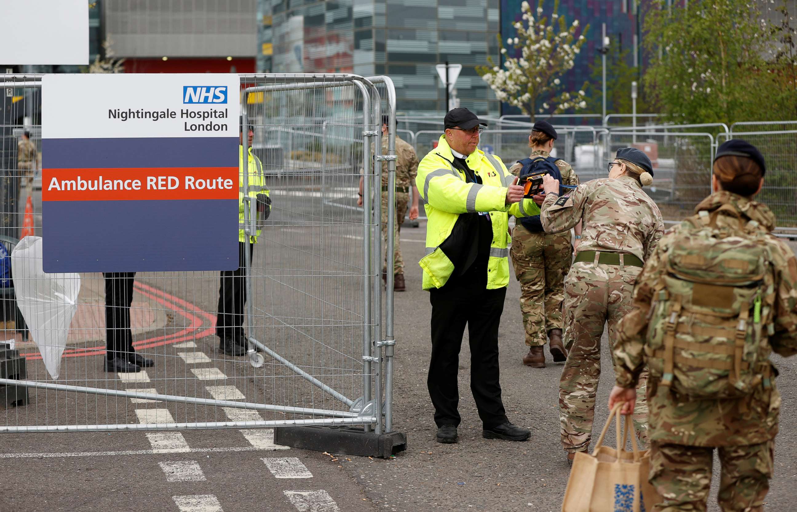 PHOTO: Military personnel arrive at the NHS Nightingale Hospital at the Excel Centre in London, as the spread of the coronavirus disease (COVID-19) continues in London, April 13, 2020. 