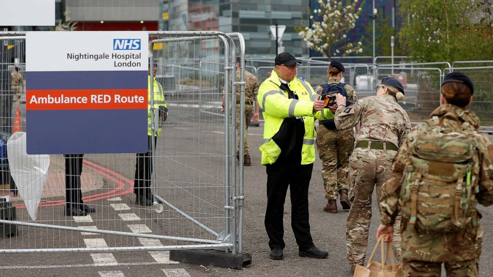 PHOTO: Military personnel arrive at the NHS Nightingale Hospital at the Excel Centre in London, as the spread of the coronavirus disease (COVID-19) continues in London, April 13, 2020. 