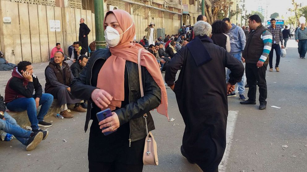 PHOTO: Egyptians bound for GCC countries gather in front of the Central Public Health Laboratories in downtown Cairo as they wait to get tested for coronavirus, March 8, 2020.